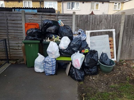 Various household items being organized for clearance in Gunnersbury