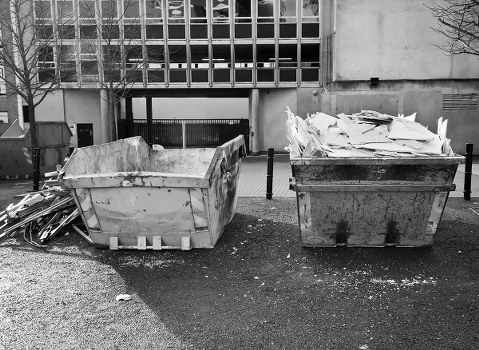 Construction site with builders removing waste
